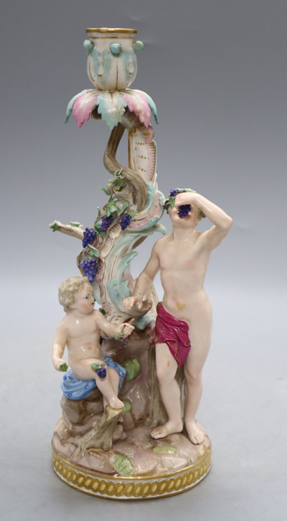 A Meissen Bacchus and cherub candelabrum, 19th century, H. 29cm